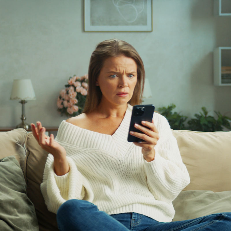 Frustrated parent searching for schools on mobile